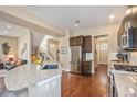Bright, modern kitchen with stainless steel appliances, open to other living spaces at 8460 E 54Th Dr, Denver, CO 80238