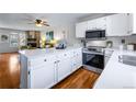 Bright kitchen with stainless steel appliances and a large countertop area at 1239 S Flower Cir # C, Lakewood, CO 80232