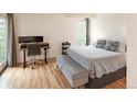 Bedroom with natural light and wood-look flooring. features desk and queen bed at 777 N Washington St # 508, Denver, CO 80203
