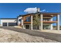 Two-story home with a three-car garage and mountain views at 5820 Powell Rd, Parker, CO 80134