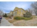 Townhome with side yard and street view at 11899 Oak Hill Way # E, Commerce City, CO 80640