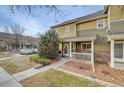 Townhome with walkway and landscaping at 11899 Oak Hill Way # E, Commerce City, CO 80640