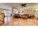 Spacious living room with hardwood floors and fireplace at 11899 Oak Hill Way # E, Commerce City, CO 80640