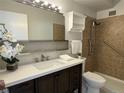 Updated bathroom with stylish vanity, modern fixtures, and tiled shower at 755 S Alton Way # 12C, Denver, CO 80247