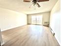 Spacious living room with natural light and access to the balcony at 755 S Alton Way # 12C, Denver, CO 80247