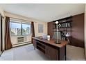 Cozy home office space with large window and built-in shelving at 13902 E Marina Dr # 412, Aurora, CO 80014