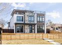 Striking modern home boasting unique architectural design, sleek lines, and inviting curb appeal at 2720 N Saint Paul St, Denver, CO 80205