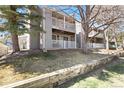 Multi-level condo building with large balconies and well-maintained landscaping at 18391 E Kepner Pl # 205, Aurora, CO 80017