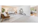 Cozy living room featuring neutral tones, stylish furnishings, and ample natural light at 1185 Yank St, Golden, CO 80401