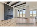 Spacious living room with a marble fireplace and hardwood floors at 9719 Canyon Wind Pt, Parker, CO 80138