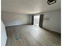 Bright living room with sleek flooring and a sliding glass door, creating a seamless indoor-outdoor flow at 8047 Wolff St # H, Westminster, CO 80031