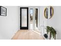Bright entryway featuring modern decor, sleek lines, and ample natural light from sidelight windows at 4236 Zuni St, Denver, CO 80211