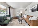 Spacious living room with hardwood floors, ample seating, and a comfortable, inviting atmosphere at 970 S Canosa Ct, Denver, CO 80219