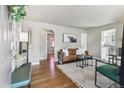 Bright living room features hardwood floors, stylish decor, and lots of natural light at 970 S Canosa Ct, Denver, CO 80219