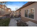 Inviting front entrance with a well-maintained walkway and manicured landscaping, creating a welcoming curb appeal at 4516 S Auckland Ct, Aurora, CO 80015