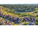 Stunning aerial view of the community showcasing lush landscaping and a network of walking trails at 9246 Sori Ln, Highlands Ranch, CO 80126