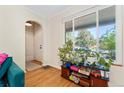 Bright living room with hardwood floors, a large window with lots of natural light, and cozy furnishings at 511 S Pennsylvania St, Denver, CO 80209