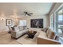 Bright living room with hardwood floors, neutral tones, and lots of natural light at 1896 Hogan Ct, Castle Rock, CO 80109