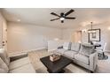 Comfortable living room seamlessly integrates into a dining area and features neutral decor at 1896 Hogan Ct, Castle Rock, CO 80109