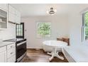 Eat-in kitchen with lots of natural light, white cabinets, and a dark oven at 1557 North St, Boulder, CO 80304