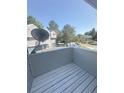 Private balcony area with wood-grained deck offers views of the community and surrounding neighborhood at 56 S Nome St, Aurora, CO 80012
