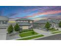 An elevated view of a lovely two-story home with gray siding and landscaping, set in a residential neighborhood at 3453 Pacific Peak Dr, Broomfield, CO 80023