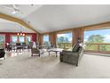 Bright living room featuring large windows showcasing stunning views, plush seating, and a cozy atmosphere at 30999 Kootney St, Elizabeth, CO 80107
