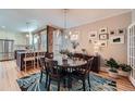 Inviting dining room featuring a round wood table and a decorative rug near the kitchen at 636 N Logan St, Denver, CO 80203