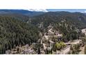 Gorgeous aerial view of the winding mountain roads surrounded by lush forestry at 41 Silver Spruce, Boulder, CO 80302
