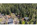 Scenic aerial view of a mountain community surrounded by lush green trees at 41 Silver Spruce, Boulder, CO 80302
