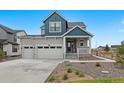 Charming two-story home featuring a spacious three car garage and quaint front porch at 1172 Elbridge Cir, Elizabeth, CO 80107