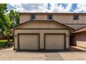 Attached two-car garage, adjacent to outdoor patio at 902 S Yukon St, Lakewood, CO 80226