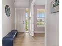 Inviting entryway with sleek floors, neutral walls, and ample natural light at 2510 E 160Th Pl, Thornton, CO 80602