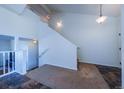 A spacious entryway, lit by recessed lighting, and accented by a plush rug at 5659 Viewpoint Ave, Firestone, CO 80504