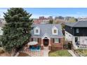 Aerial view of a charming brick home with well-manicured landscaping and a cozy patio area at 35 S Albion St, Denver, CO 80246