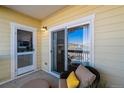 Cozy balcony with comfortable seating, ideal for enjoying the outdoors and neighborhood views at 9471 Ashbury Cir # 202, Parker, CO 80134