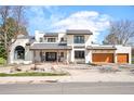 Stunning contemporary home with a well-manicured lawn, beautiful landscaping, and a welcoming entrance at 3930 S Pinehurst Cir, Denver, CO 80235