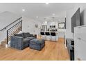 Open concept living room with hardwood floors and modern kitchen at 1403 Yates St, Denver, CO 80204