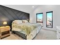 Spacious bedroom with large windows and a geometric accent wall at 1403 Yates St, Denver, CO 80204