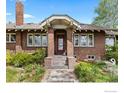 Beautiful brick home with a stately entrance and well-maintained landscaping at 2601 N Clayton St, Denver, CO 80205