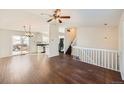 Open concept living space with hardwood floors, kitchen, and loft area at 137 S Bedford Ave, Castle Rock, CO 80104