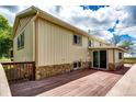 Spacious deck with stone accents perfect for outdoor entertaining at 73 N Dutch Valley Rd, Bennett, CO 80102