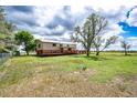 Large backyard with beautiful landscaping and a spacious deck at 73 N Dutch Valley Rd, Bennett, CO 80102
