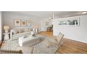 Bright and airy living room with stylish furniture and beautiful hardwood floors at 2235 Edgewood Dr, Boulder, CO 80304