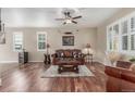 Spacious living room with hardwood floors and abundant natural light at 129 N Irvington St, Aurora, CO 80018