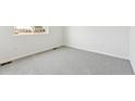Clean bedroom features plush carpeting, base trim, and bright natural light at 9742 Cathay St, Commerce City, CO 80022