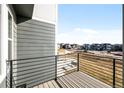 Balcony view overlooking neighborhood under construction on a sunny day at 2672 W 68Th Ave, Denver, CO 80221