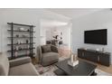 Open-concept living area flows seamlessly into the dining area at 11 W Ellsworth Ave # 22, Denver, CO 80223