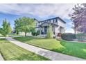 Well maintained single Gathering home with manicured lawn and mature landscaping at 12400 Village Cir, Brighton, CO 80603