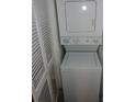 Efficiently designed laundry area featuring a stacked washer and dryer unit, maximizing space in the home at 14740 E Kentucky Dr # 725, Aurora, CO 80012